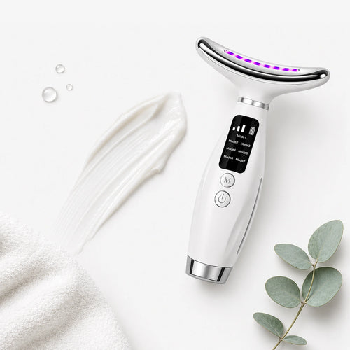 Face Lifting Device beside a swipe of cream and a eucalyptus sprig